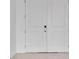 White double front doors with modern hardware at 8562 Shore Lake Dr, Englewood, FL 34224
