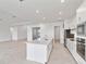 Modern kitchen featuring a long island, stainless steel appliances, and recessed lighting at 8562 Shore Lake Dr, Englewood, FL 34224