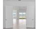 A stunning view framed by grand doors into the living room at 8562 Shore Lake Dr, Englewood, FL 34224