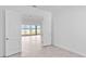 Bright living room featuring tile floors, an open floor plan, and picturesque lake views at 8562 Shore Lake Dr, Englewood, FL 34224