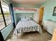 Charming bedroom with bunk beds, wood floors, and access to a private balcony and natural light at 8694 Marsh St, Placida, FL 33946