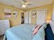 Spacious main bedroom featuring wood floors, beach decor, and a large closet at 8694 Marsh St, Placida, FL 33946