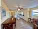 Eat-in kitchen with wood floors, an island and stainless steel appliances, perfect for Gathering meals and entertaining at 8694 Marsh St, Placida, FL 33946
