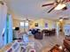 Open floor plan with hardwood floors and multiple seating areas for a relaxed living experience at 8694 Marsh St, Placida, FL 33946