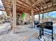 Outdoor living area, including a tiki bar, grilling area, and comfortable seating for enjoying the outdoors at 8694 Marsh St, Placida, FL 33946
