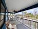 Relaxing screened porch with outdoor dining, ceiling fan, and a picturesque view at 8694 Marsh St, Placida, FL 33946