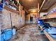 Organized storage room featuring shelving, plywood walls, and ample space for tools and equipment at 8694 Marsh St, Placida, FL 33946