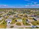 This aerial shot highlights the home's location within a tranquil neighborhood, showcasing its spacious surroundings and serene setting at 91 Beverly Cir, Englewood, FL 34223