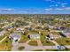 Aerial view of the property showing its layout within the neighborhood, highlighting its location and surrounding landscape at 91 Beverly Cir, Englewood, FL 34223