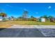 Expansive backyard featuring a patio area and a storage shed at 91 Beverly Cir, Englewood, FL 34223