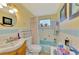 Cozy bathroom with blue accents, charming decor, and a bright, welcoming atmosphere at 91 Beverly Cir, Englewood, FL 34223