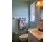 Cozy bathroom featuring a toilet, sink, and an elephant-themed towel at 91 Beverly Cir, Englewood, FL 34223