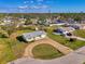 Charming single-story home with a well-manicured lawn and a circular driveway, nestled in a peaceful neighborhood at 91 Beverly Cir, Englewood, FL 34223