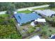 Overhead view of a house with a gazebo and backyard fire pit in a fenced yard at 9341 Oceanspray Blvd, Englewood, FL 34224