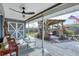 Charming back patio with a covered area, pergola, and serene garden, ideal for outdoor gatherings and relaxation at 9341 Oceanspray Blvd, Englewood, FL 34224