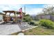 Landscaped backyard featuring a pergola, garden, and well-maintained lawn, offering a peaceful outdoor retreat at 9341 Oceanspray Blvd, Englewood, FL 34224