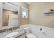 Bathroom featuring granite countertop, toilet and shower/bath combo at 9341 Oceanspray Blvd, Englewood, FL 34224