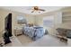 Bedroom with a bed, side table, and desk at 9341 Oceanspray Blvd, Englewood, FL 34224