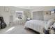 Bright bedroom with a large window, vanity, full-length mirror, and ample natural light creating a serene atmosphere at 9341 Oceanspray Blvd, Englewood, FL 34224