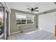 Eat-in breakfast nook with sliding glass doors, tile floors, a ceiling fan, and access to the backyard at 9341 Oceanspray Blvd, Englewood, FL 34224