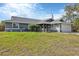 Charming single Gathering home featuring an attached garage and well-manicured lawn at 9341 Oceanspray Blvd, Englewood, FL 34224