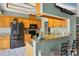 Functional kitchen featuring granite countertops, stainless steel appliances, and wooden cabinetry at 9341 Oceanspray Blvd, Englewood, FL 34224
