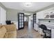 Inviting living room with hardwood floors, comfortable seating, and natural light, perfect for relaxation and entertainment at 9341 Oceanspray Blvd, Englewood, FL 34224