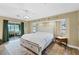 Main bedroom with wood floors, slider door, and bright natural light at 9341 Oceanspray Blvd, Englewood, FL 34224