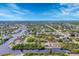 Expansive aerial view of a waterfront community with canals, homes, and lush landscaping at 9460 Migue Cir, Port Charlotte, FL 33981