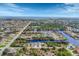 Stunning aerial view of a waterfront community with winding canals and beautiful homes at 9460 Migue Cir, Port Charlotte, FL 33981
