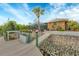 Dock and waterfront backyard with lush landscaping, plants and screened in patio at 9460 Migue Cir, Port Charlotte, FL 33981