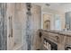 This contemporary bathroom features a sleek, tiled shower with a built-in bench and shelving for toiletries at 9460 Migue Cir, Port Charlotte, FL 33981