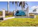 Well-maintained community sign for South Gulf Cove with lush landscaping and mature palm trees at 9460 Migue Cir, Port Charlotte, FL 33981