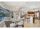 Dining Area with view of kitchen, bar and screened in pool area at 9460 Migue Cir, Port Charlotte, FL 33981