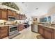 Bright kitchen with stainless steel appliances, granite counters and breakfast bar at 9460 Migue Cir, Port Charlotte, FL 33981