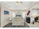 This bright main bedroom boasts a tray ceiling, ensuite office, and stylish decor at 9460 Migue Cir, Port Charlotte, FL 33981