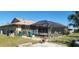 Fenced backyard with a covered pool area ideal for outdoor activities at 95 Mark Twain Ln, Rotonda West, FL 33947