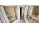 Full bathroom features a standard shower-tub combination and tiled walls at 95 Mark Twain Ln, Rotonda West, FL 33947