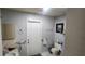 A full bathroom with a toilet, towel rack, and sink with cabinet at 95 Mark Twain Ln, Rotonda West, FL 33947