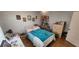 Cozy bedroom with ample space, framed photos, and wood floors at 95 Mark Twain Ln, Rotonda West, FL 33947