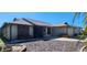Charming single-story home features a well-maintained lawn and attached garage at 95 Mark Twain Ln, Rotonda West, FL 33947
