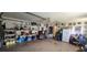 Large garage with storage space, shelving, and a utility area at 95 Mark Twain Ln, Rotonda West, FL 33947