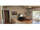 Bright living room with vaulted ceilings, wood floors, and a comfortable seating area at 95 Mark Twain Ln, Rotonda West, FL 33947