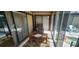 Enclosed sunroom with tile floors and views of the pool area at 95 Mark Twain Ln, Rotonda West, FL 33947
