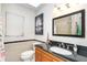 Bathroom vanity and commode at 10075 Bentley Ave, Englewood, FL 34224