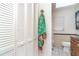 Bathroom with neutral tile, toilet, and built-in storage at 10075 Bentley Ave, Englewood, FL 34224