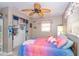 Bedroom with ceiling fan and built-in storage at 10075 Bentley Ave, Englewood, FL 34224