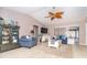 Comfortable seating arrangement, with a decorative shelving unit, and bright natural light at 10075 Bentley Ave, Englewood, FL 34224