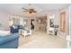 Open-concept layout with a well-lit dining area, comfortable seating, and stylish decor accents at 10075 Bentley Ave, Englewood, FL 34224