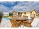 Inviting pool area featuring a patio table with seating, and a sparkling pool perfect for relaxing and entertaining at 10075 Bentley Ave, Englewood, FL 34224
